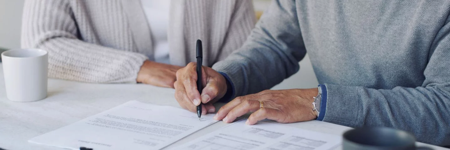 Man signing a document
