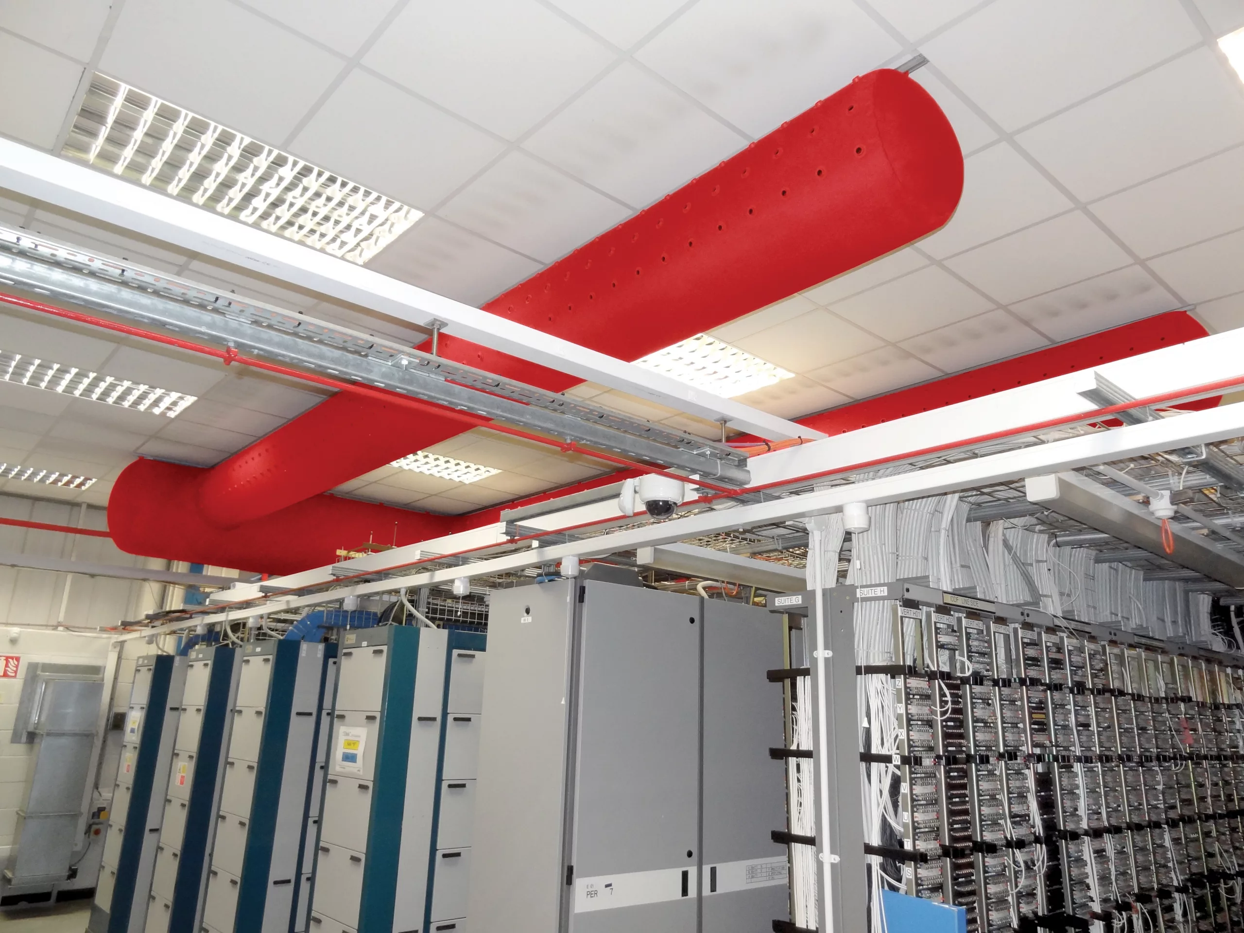 Red fabric duct systems inside Virgin Media data center, UK