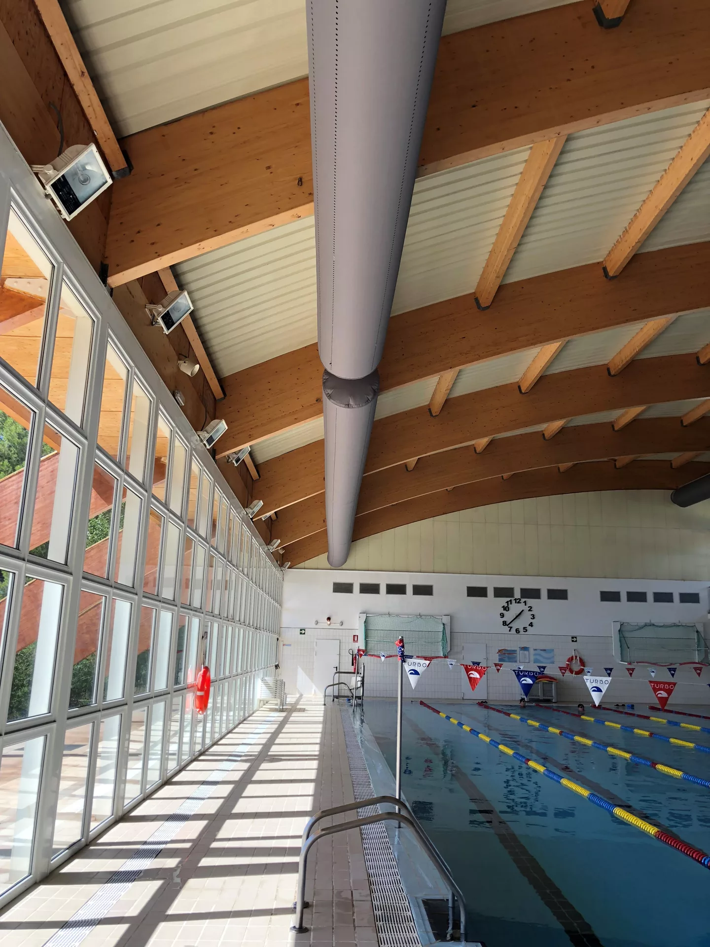 Grey fabric duct sock in Piscina Cubierta swimming pool, ES