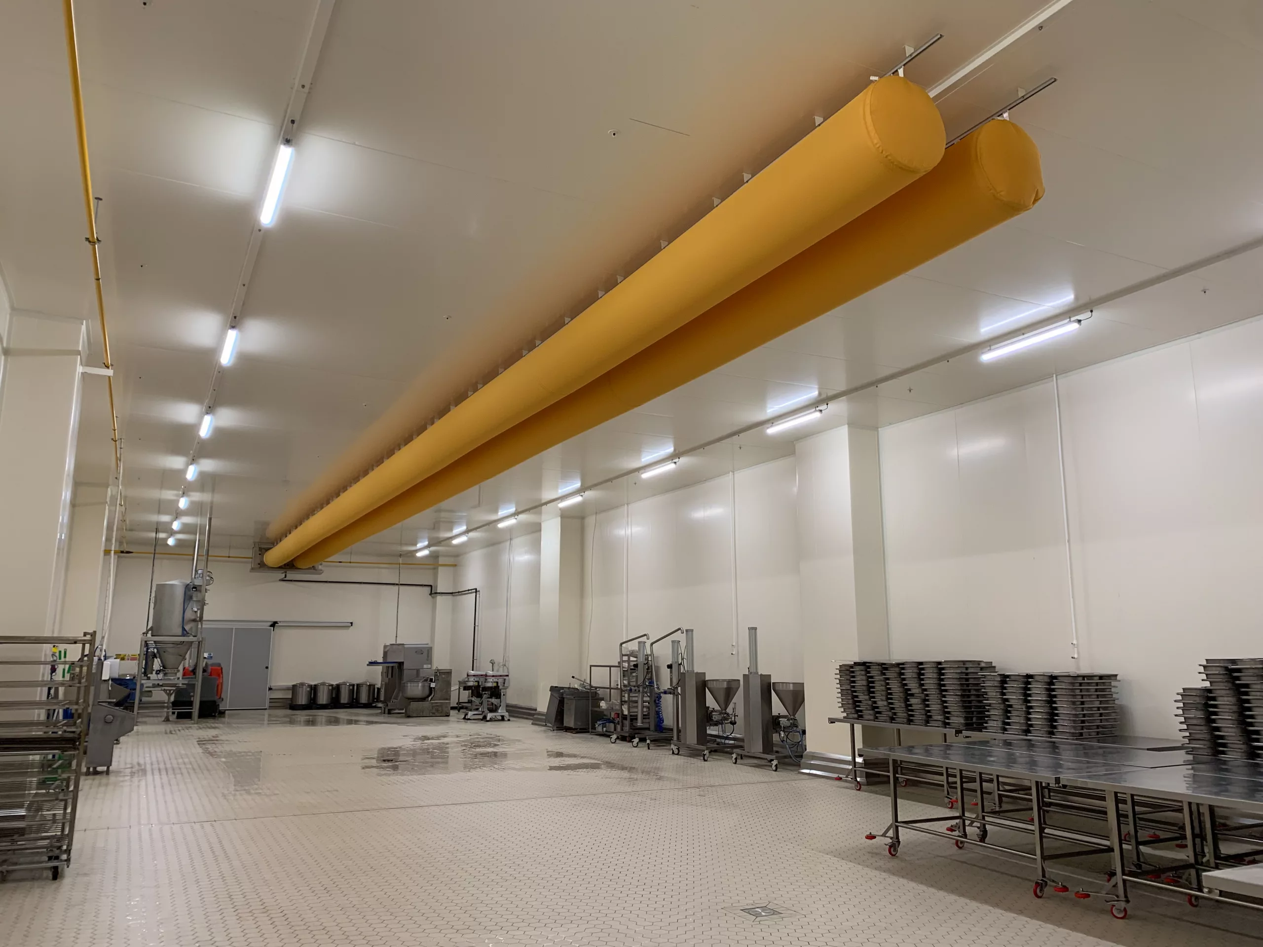 Zip-a-duct yellow fabric duct system inside a factory