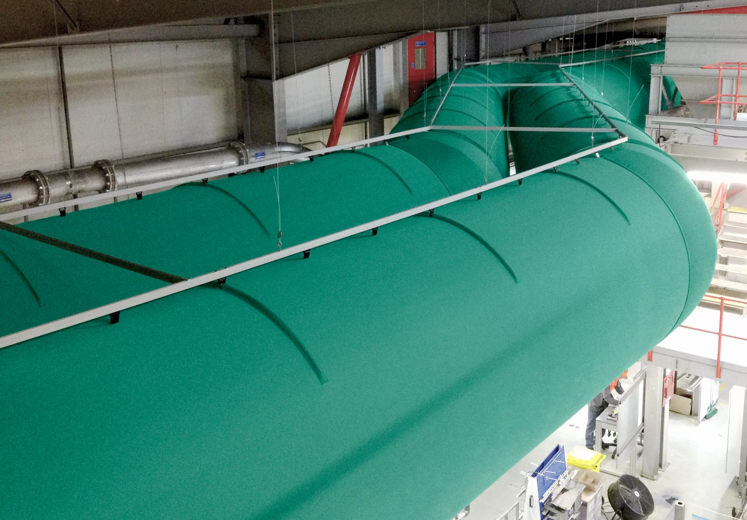 All-in-one green zip-a-duct fabric duct systems installed inside Nestle Purina production factory