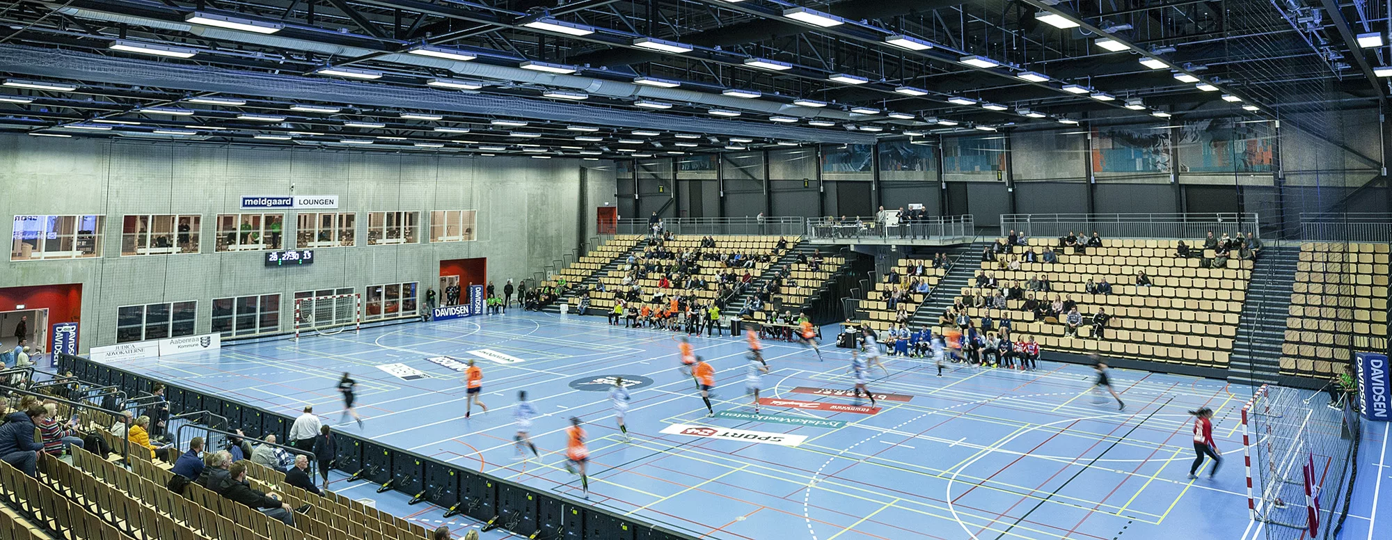 Grey zipaduct fabric ducting system in Åbenrå Sports Arena, DK