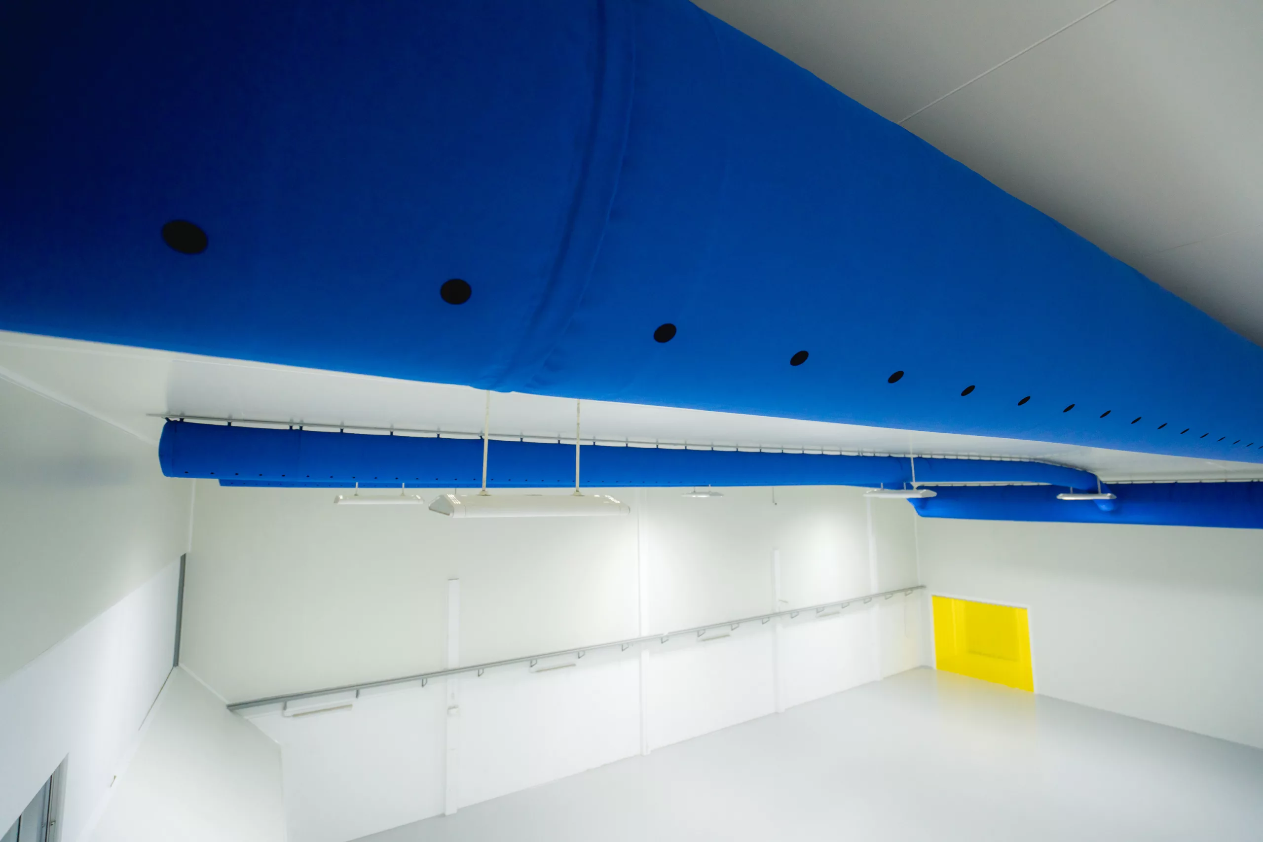 Blue, industrial air ducting inside a chocolate factory