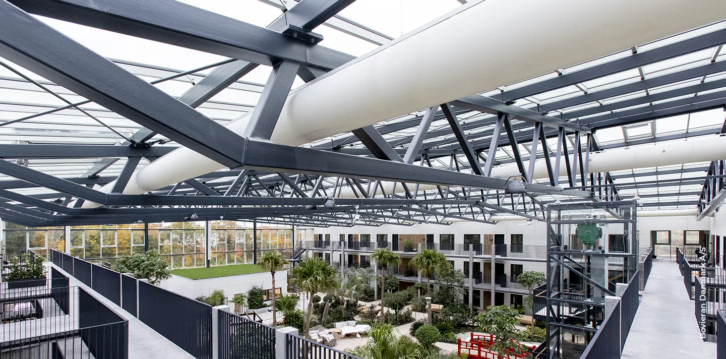 White zipaduct sock duct inside Boveiran senior housing complex, DK