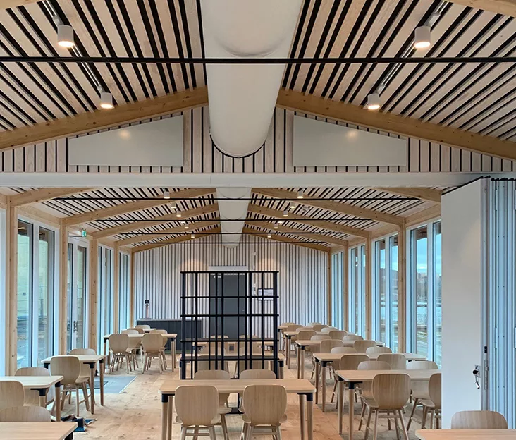 White zip-a-duct fabric duct installed in Kroatorpet cafe, Sweden