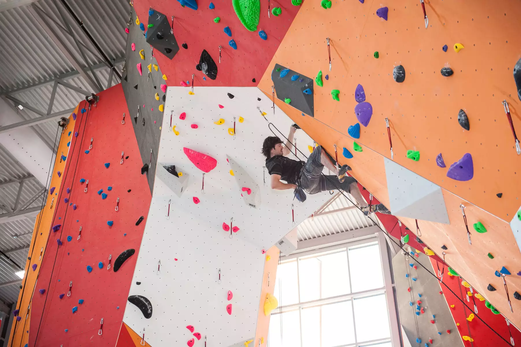 White zipaduct fabric duct inside a rock climbing facility