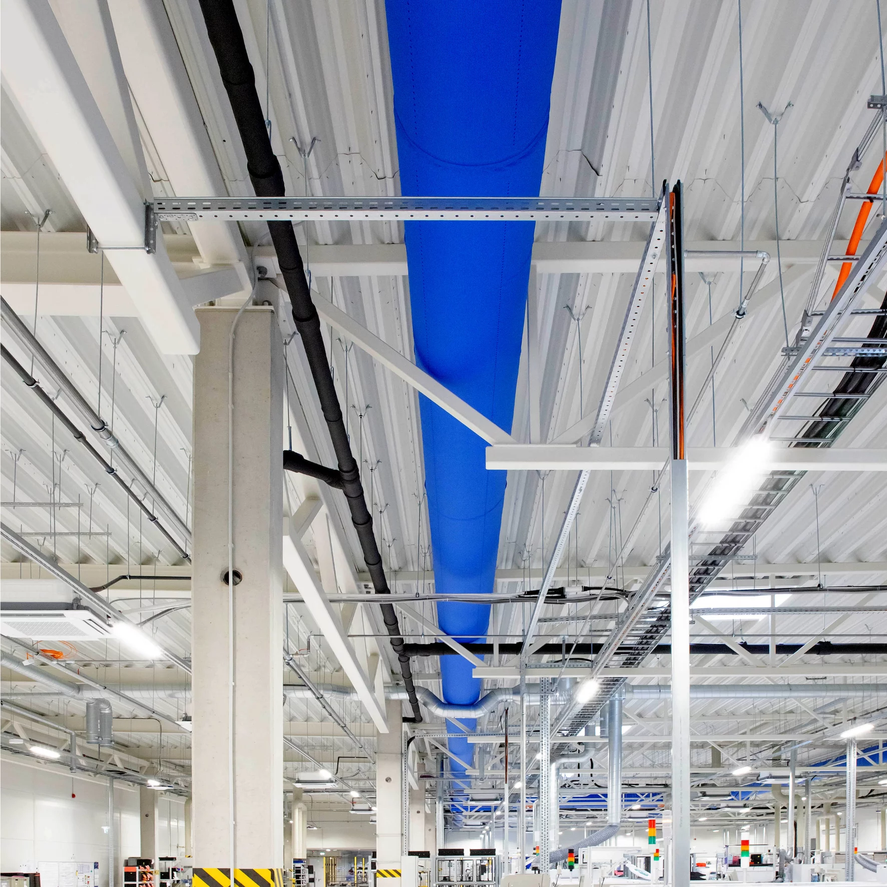 Blue fabric duct inside Axioma factory, LT